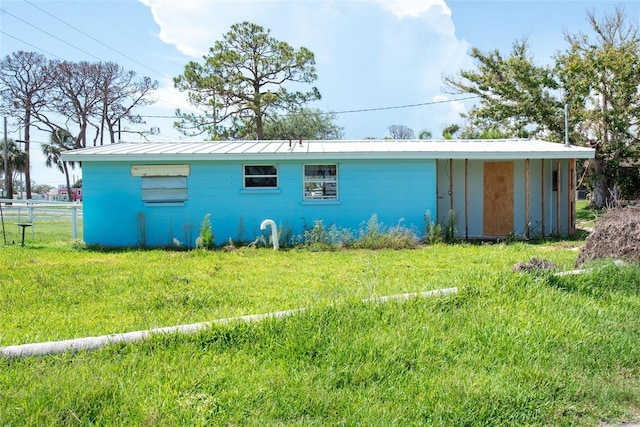 1999 Placida Rd, Englewood, FL 34223 - rear view of property with a standing seam roof and a metal roof