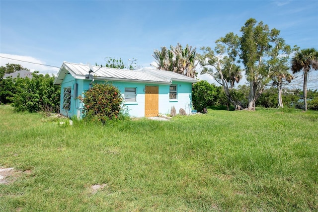 1999 Placida Rd, Englewood, FL 34223 - view of front facade with a metal roof