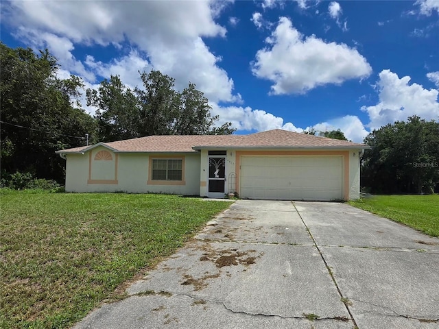 4900 Hurley Ave, North Port, FL 34288 - ranch-style home featuring stucco siding, a front lawn, a garage, and concrete driveway
