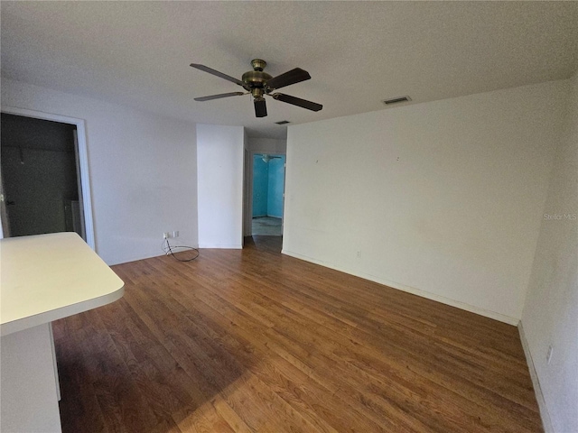 4900 Hurley Ave, North Port, FL 34288 - unfurnished room with wood finished floors, ceiling fan, and a textured ceiling