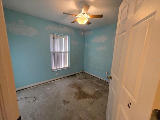 4900 Hurley Ave, North Port, FL 34288 - unfurnished bedroom featuring unfinished concrete floors and a ceiling fan