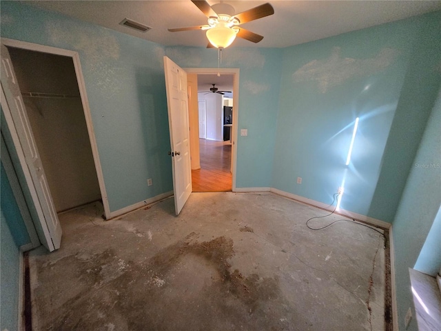 4900 Hurley Ave, North Port, FL 34288 - unfurnished bedroom with concrete flooring, a closet, and a ceiling fan