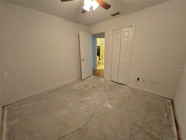 4900 Hurley Ave, North Port, FL 34288 - unfurnished bedroom featuring unfinished concrete floors, ceiling fan, and a closet