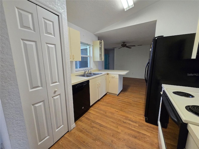 4900 Hurley Ave, North Port, FL 34288 - kitchen with dishwasher, a peninsula, vaulted ceiling, range with electric cooktop, and a ceiling fan