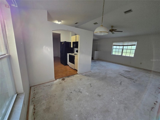 4900 Hurley Ave, North Port, FL 34288 - kitchen with black appliances, arched walkways, concrete floors, a ceiling fan, and pendant lighting