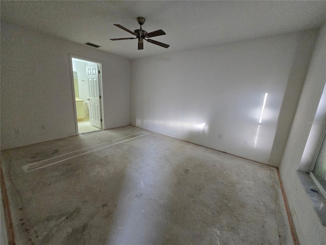 4900 Hurley Ave, North Port, FL 34288 - unfurnished bedroom with concrete flooring, ensuite bath, and a ceiling fan