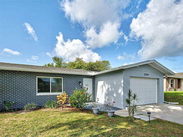 21519 Fairway Ave, Port Charlotte, FL 33952 - single story home with an attached garage, driveway, a front yard, and brick siding