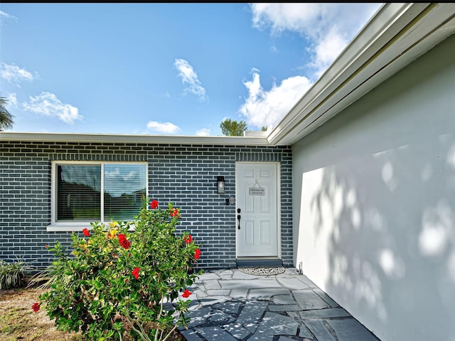 21519 Fairway Ave, Port Charlotte, FL 33952 - view of exterior entry featuring brick siding