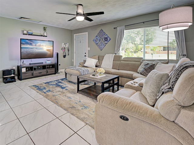 21519 Fairway Ave, Port Charlotte, FL 33952 - living area with ceiling fan and marble look tiles