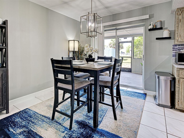 21519 Fairway Ave, Port Charlotte, FL 33952 - dining area with baseboards and a chandelier