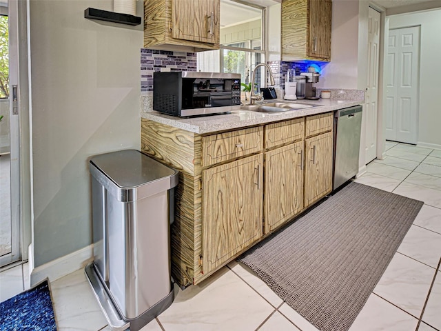 21519 Fairway Ave, Port Charlotte, FL 33952 - kitchen featuring stainless steel appliances, a sink, light countertops, backsplash, and baseboards