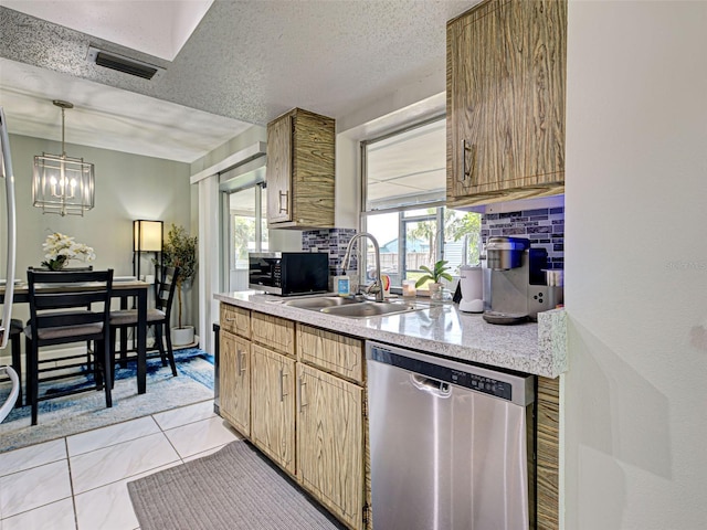 21519 Fairway Ave, Port Charlotte, FL 33952 - kitchen with stainless steel appliances, a sink, light countertops, healthy amount of natural light, and a textured ceiling