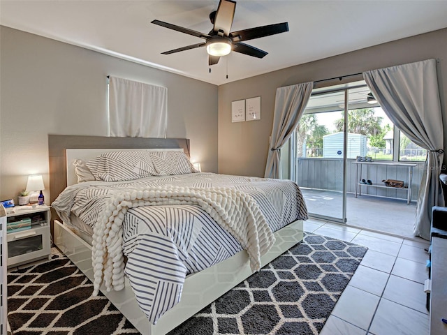 21519 Fairway Ave, Port Charlotte, FL 33952 - bedroom featuring access to exterior, tile patterned flooring, and a ceiling fan