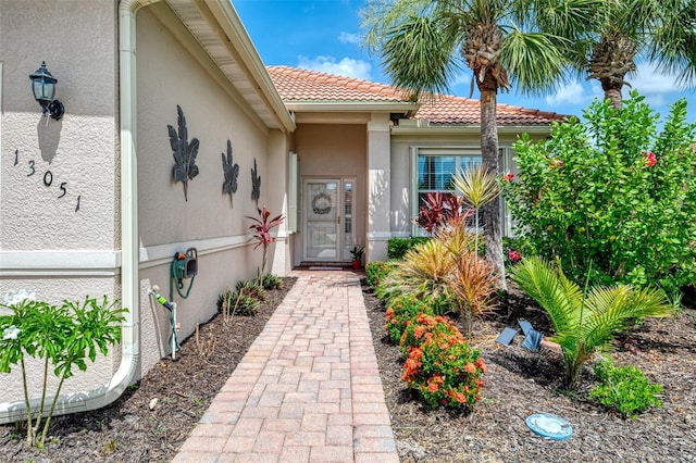 13051 Creekside Ln, Port Charlotte, FL 33953 - entrance to property with stucco siding and a tile roof