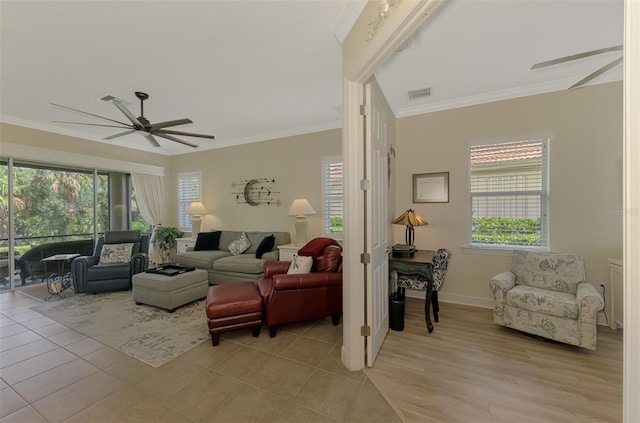 13051 Creekside Ln, Port Charlotte, FL 33953 - living room with a ceiling fan, plenty of natural light, ornamental molding, and light tile patterned floors