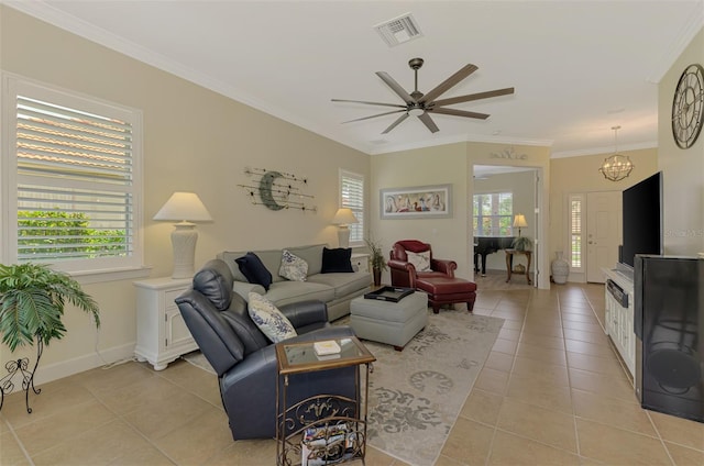 13051 Creekside Ln, Port Charlotte, FL 33953 - living area featuring light tile patterned floors, ornamental molding, ceiling fan, and a chandelier