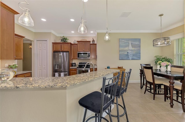 13051 Creekside Ln, Port Charlotte, FL 33953 - kitchen featuring stainless steel appliances, decorative backsplash, crown molding, light stone countertops, and light tile patterned flooring