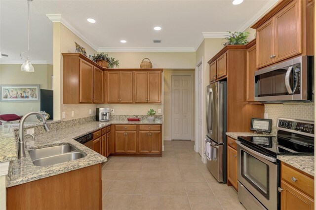 13051 Creekside Ln, Port Charlotte, FL 33953 - kitchen featuring appliances with stainless steel finishes, tasteful backsplash, light stone counters, light tile patterned flooring, and a peninsula