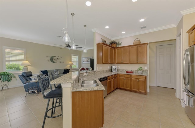 13051 Creekside Ln, Port Charlotte, FL 33953 - kitchen featuring appliances with stainless steel finishes, open floor plan, a peninsula, light tile patterned floors, and healthy amount of natural light