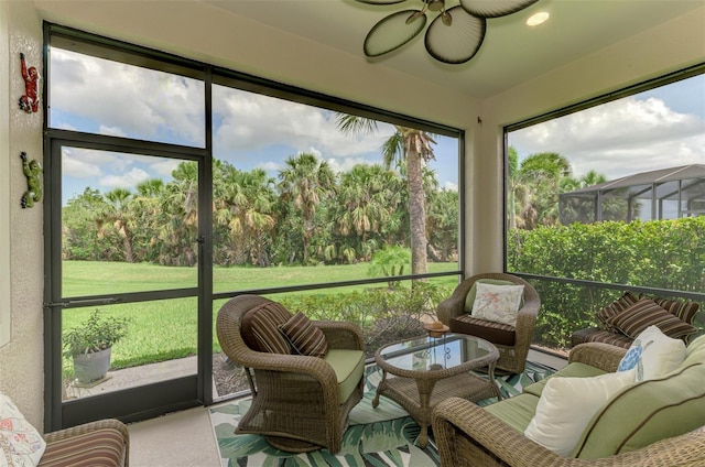 13051 Creekside Ln, Port Charlotte, FL 33953 - sunroom / solarium with a ceiling fan, view of wooded area, and an outdoor living space