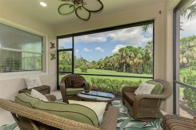 13051 Creekside Ln, Port Charlotte, FL 33953 - sunroom / solarium with ceiling fan, outdoor lounge area, and view of scattered trees