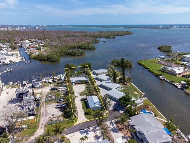 1765 Manor Rd, Englewood, FL 34223 - aerial view of property and surrounding area featuring a nearby body of water and property parcel outlined