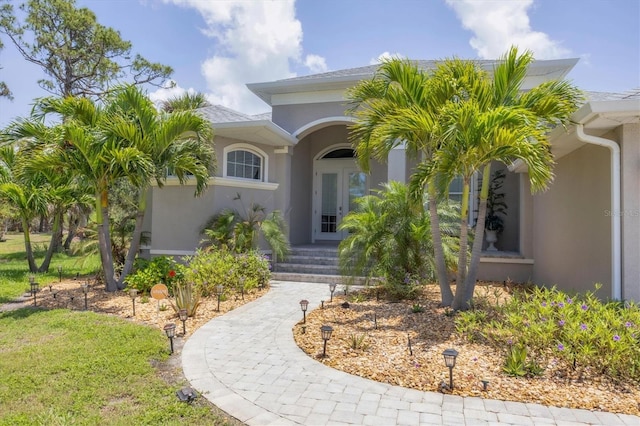 124 Cutlass Dr, Rotonda West, FL 33947 - property entrance with stucco siding