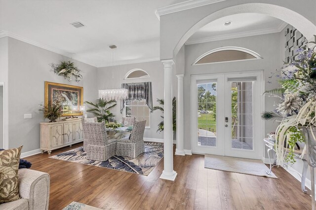 124 Cutlass Dr, Rotonda West, FL 33947 - foyer featuring decorative columns, wood-type flooring, french doors, and ornamental molding
