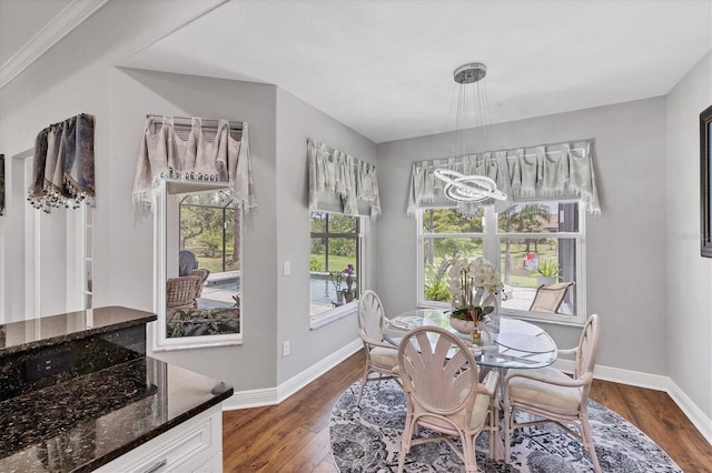 124 Cutlass Dr, Rotonda West, FL 33947 - dining room with dark wood-type flooring