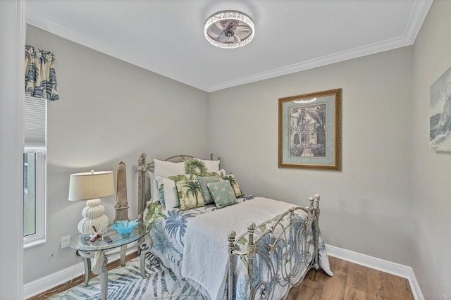 124 Cutlass Dr, Rotonda West, FL 33947 - bedroom featuring wood finished floors and crown molding