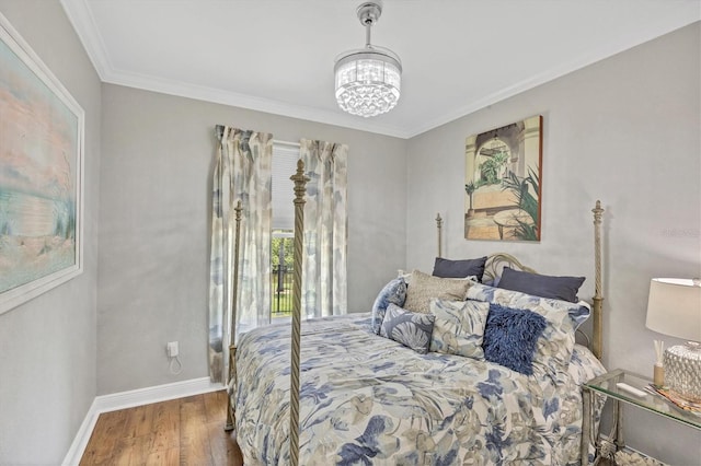 124 Cutlass Dr, Rotonda West, FL 33947 - bedroom featuring wood finished floors, a chandelier, and ornamental molding