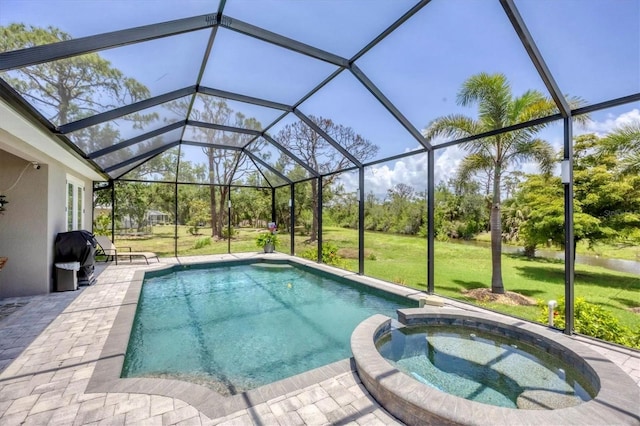 124 Cutlass Dr, Rotonda West, FL 33947 - view of swimming pool featuring a lawn, a grill, a patio, a pool with connected hot tub, and glass enclosure
