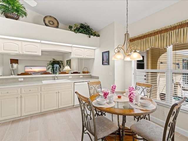 23 Pine Valley Ct, Rotonda West, FL 33947 - dining space featuring lofted ceiling and light wood finished floors