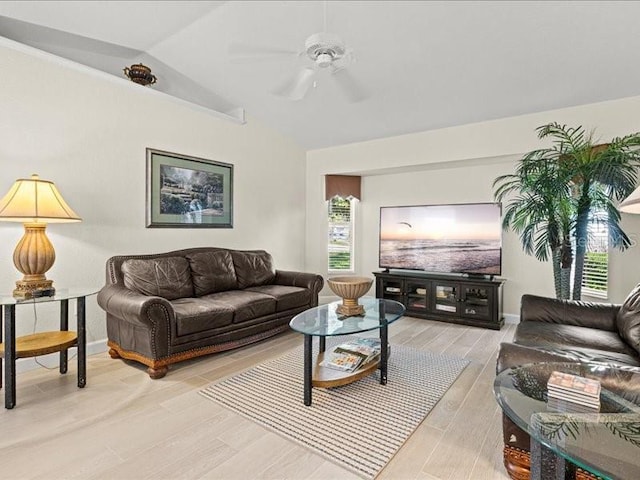 23 Pine Valley Ct, Rotonda West, FL 33947 - living area with lofted ceiling, light wood-style flooring, and a ceiling fan