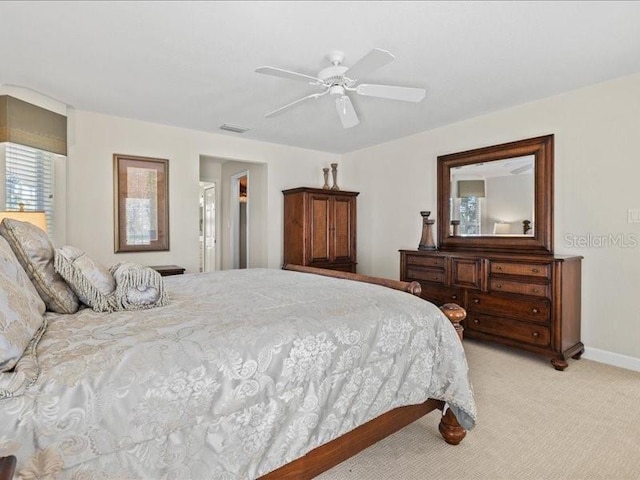 23 Pine Valley Ct, Rotonda West, FL 33947 - bedroom with light carpet and ceiling fan