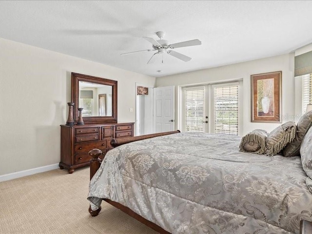 23 Pine Valley Ct, Rotonda West, FL 33947 - bedroom featuring light carpet, multiple windows, french doors, and ceiling fan