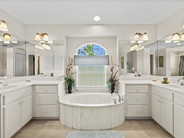 23 Pine Valley Ct, Rotonda West, FL 33947 - bathroom featuring a bath and two vanities