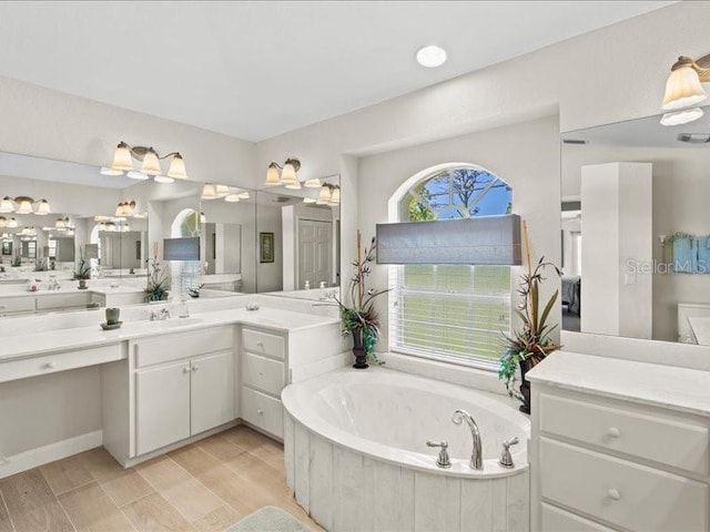 23 Pine Valley Ct, Rotonda West, FL 33947 - bathroom with a bath and vanity