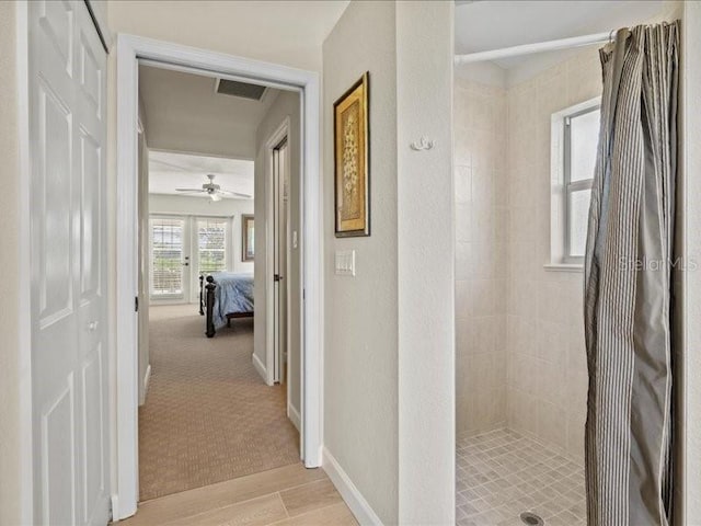 23 Pine Valley Ct, Rotonda West, FL 33947 - hall with light wood-type flooring and baseboards