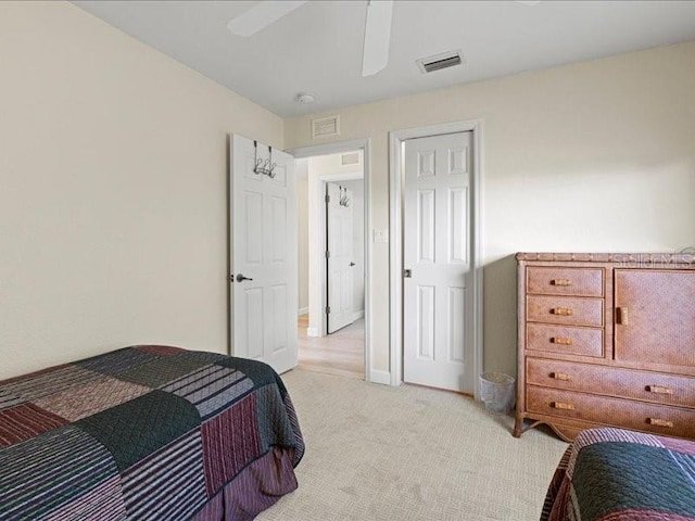 23 Pine Valley Ct, Rotonda West, FL 33947 - bedroom with light colored carpet and a ceiling fan