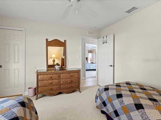 23 Pine Valley Ct, Rotonda West, FL 33947 - bedroom with light carpet and ceiling fan