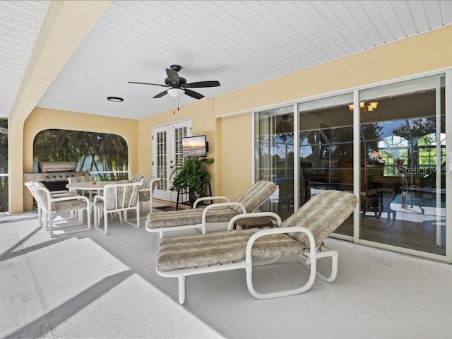 23 Pine Valley Ct, Rotonda West, FL 33947 - view of patio with ceiling fan, outdoor dining space, and french doors