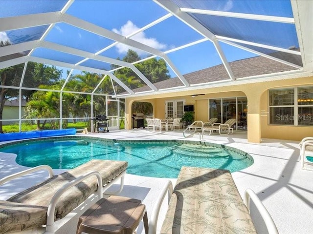 23 Pine Valley Ct, Rotonda West, FL 33947 - outdoor pool with a patio, grilling area, and a lanai