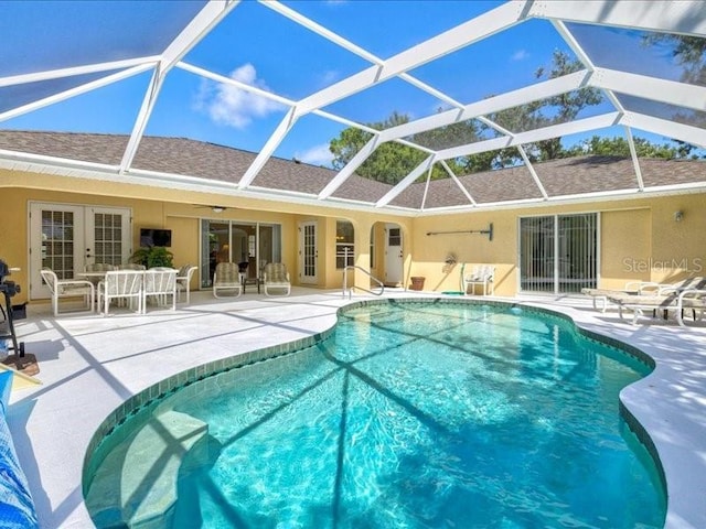 23 Pine Valley Ct, Rotonda West, FL 33947 - outdoor pool with a patio and glass enclosure