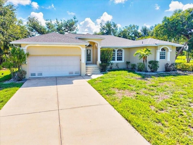 23 Pine Valley Ct, Rotonda West, FL 33947 - ranch-style house featuring an attached garage, concrete driveway, stucco siding, and a front lawn