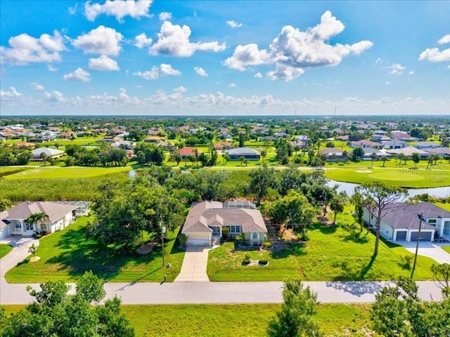 23 Pine Valley Ct, Rotonda West, FL 33947 - aerial perspective of suburban area featuring a large body of water and a local golf course