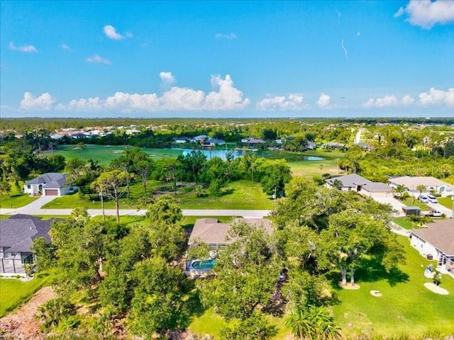 23 Pine Valley Ct, Rotonda West, FL 33947 - aerial view of residential area with a nearby body of water and a tree filled landscape