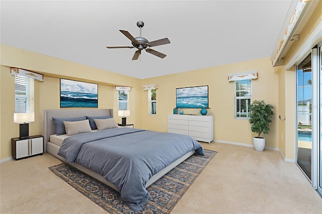 127 Jennifer Dr, Rotonda West, FL 33947 - bedroom with light colored carpet, multiple windows, and access to outside