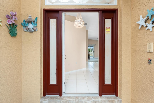 127 Jennifer Dr, Rotonda West, FL 33947 - property entrance with stucco siding