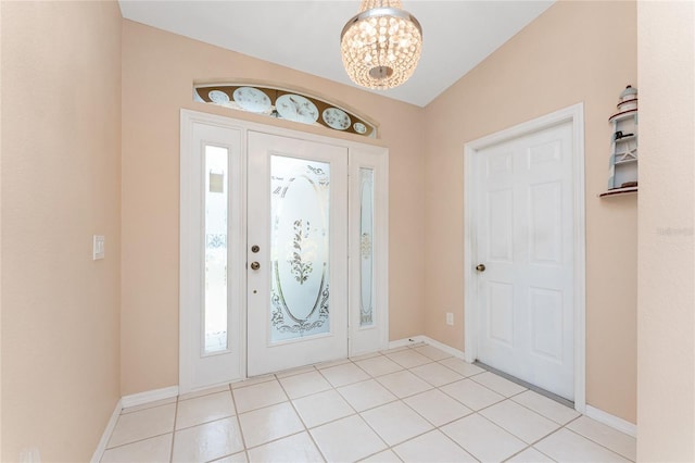 127 Jennifer Dr, Rotonda West, FL 33947 - entrance foyer featuring a chandelier and light tile patterned floors